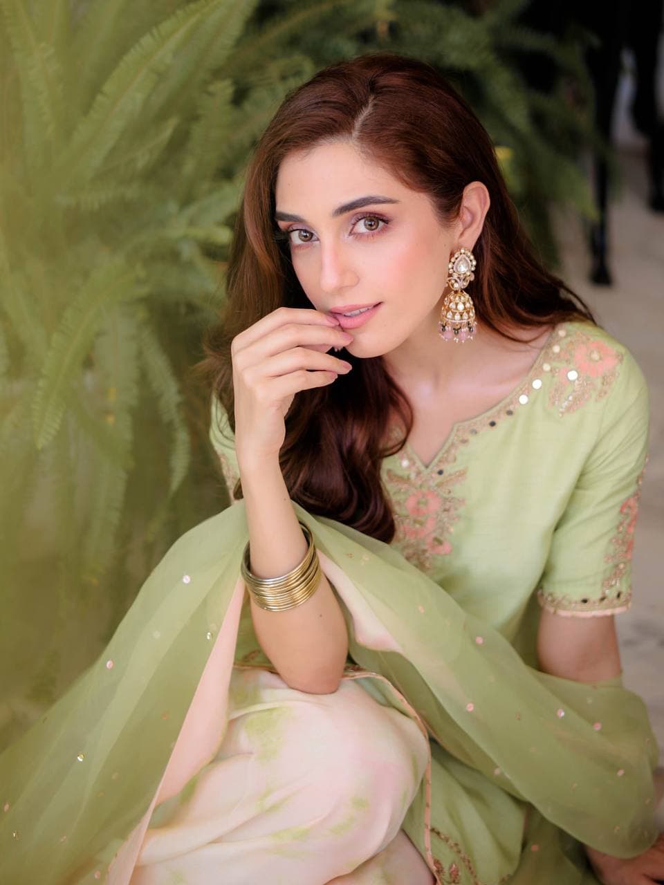 Serene Beauty: A Young Muse Adorned in Lush Green thumbnail 4